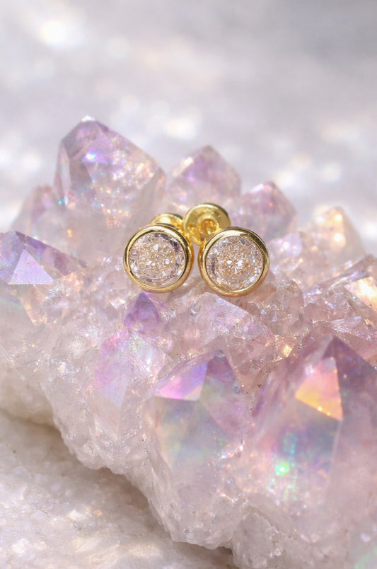 Aretes solitario blanco en oro amarillo 14K