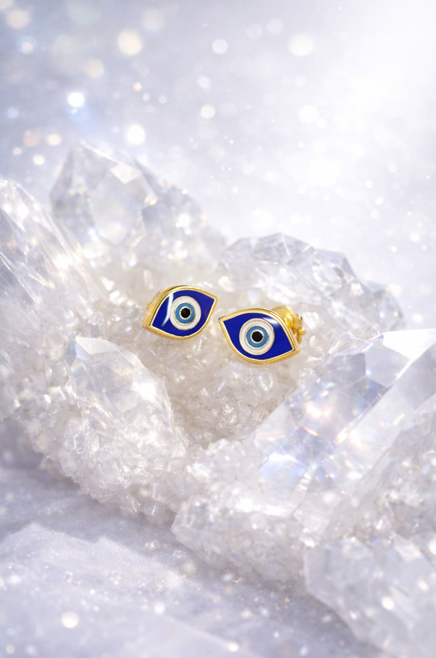 Aretes ojo azul en oro amarillo 14k con cerradura de bebé