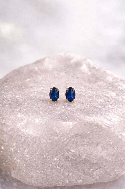 Aretes solitario azul en oro amarillo 10K