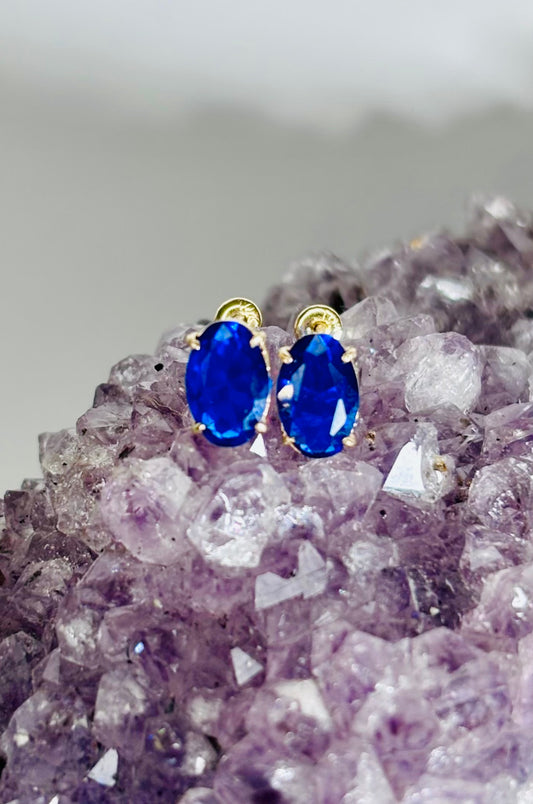 Aretes solitario azul en oro amarillo 10K