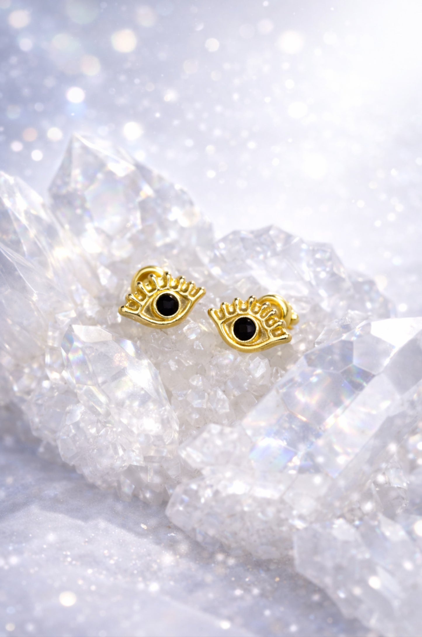 Aretes ojo protector en oro amarillo 14k con cerradura de bebé